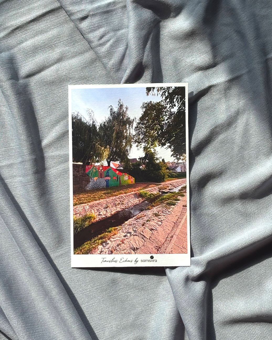 A set of three 5x7 inch photo art prints displayed on a textured surface, featuring images with architectural elements and warm tones.