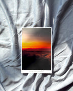 Mini nature sunset art print displayed on a grey surface