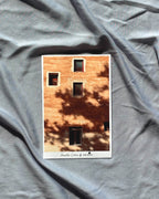 Postcard with a brick wall design on crumpled gray fabric