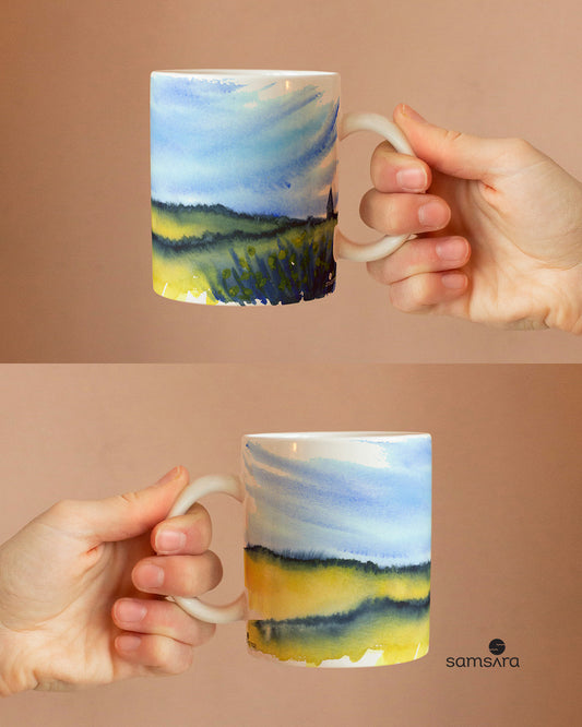 Watercolor ceramic mug with blue sky and wildflower field design - nature art coffee mug by Samsara Mumbai